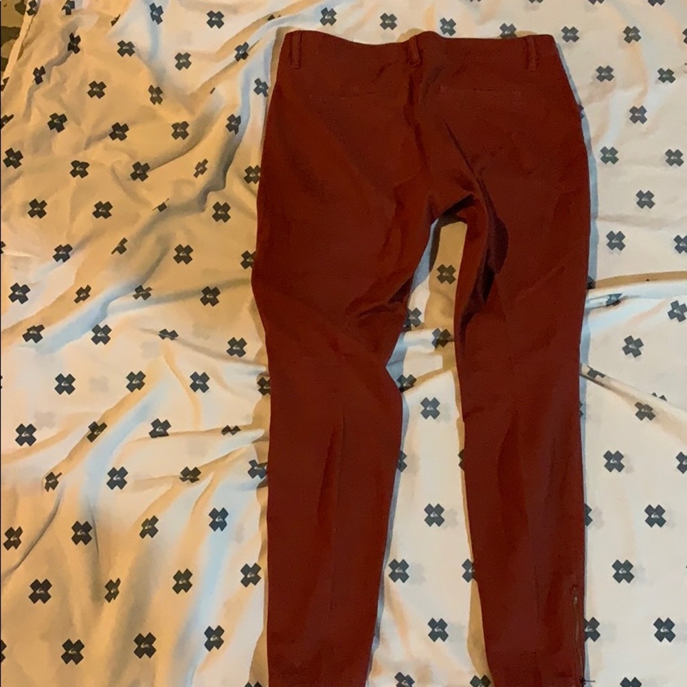 Orange color jeans.